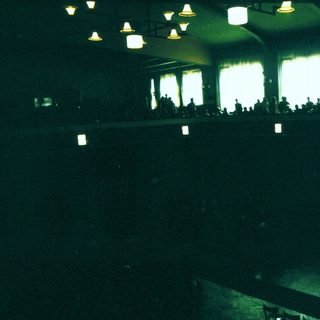Empty concert or event venue with stage lights.