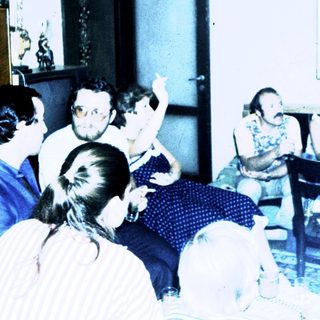 Group discussion or meeting in a casual indoor setting.