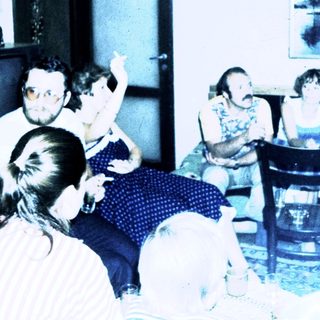 Group discussion or meeting in a casual indoor setting.