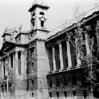 Historic building under partial renovation or damage.