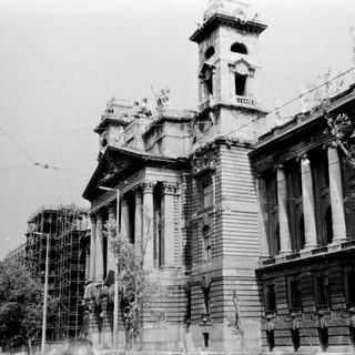Historic building under partial renovation or damage.