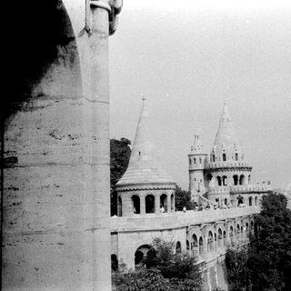 Historic castle with towers and arched walls.