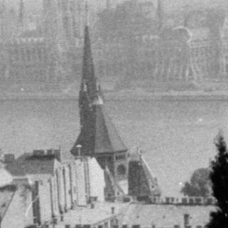 Historic black-and-white view of Budapest skyline by Danube.