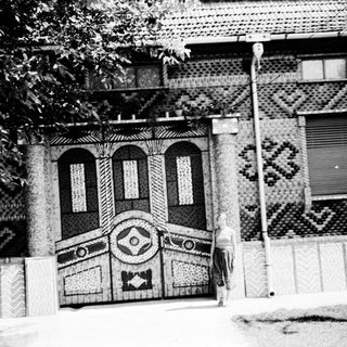 Elaborate brick facade with geometric patterns and decorative arches.