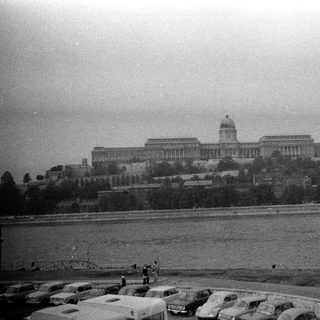 Historic building complex by waterfront.