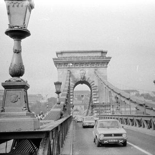 Iconic black-and-white photo of the Széchenyi Chain Bridge in Budapest.
