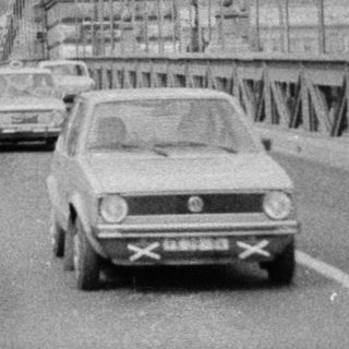 Iconic black-and-white photo of the Széchenyi Chain Bridge in Budapest.