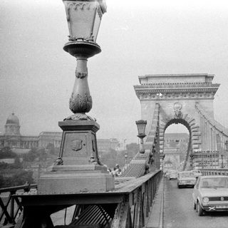 Iconic black-and-white photo of the Széchenyi Chain Bridge in Budapest.
