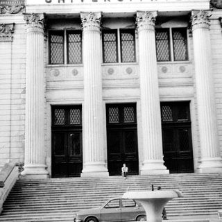 Grand neoclassical building entrance with steps.