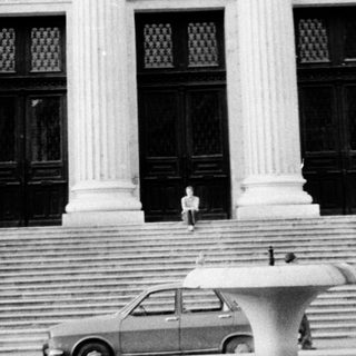 Grand neoclassical building entrance with steps.