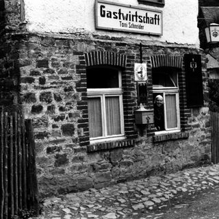 Traditional German inn named Gastwirtschaft Toni Schneider.
