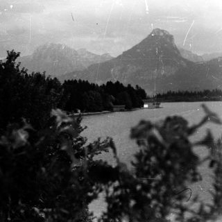 Mountainous lake landscape with forested shores.