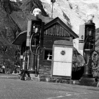 Mountain station with cable car near glacier.