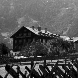 Alpine village with church and parked bicycles.
