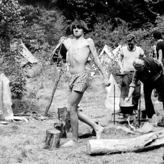 People engaged in outdoor survival or camping training.