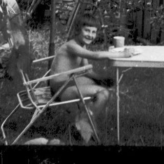 "Destructed garden scene with overturned furniture and debris."