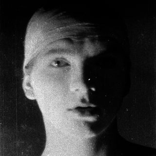 Black-and-white portrait of a young person in profile.