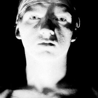 Close-up portrait of person with bandaged head.