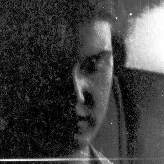 Blurred black-and-white portrait of a person.