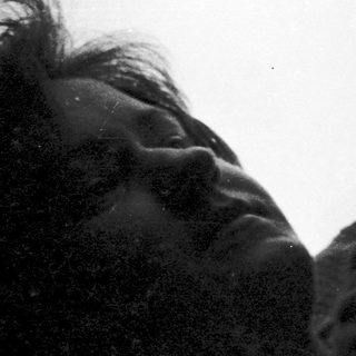 Person resting head on airplane window.