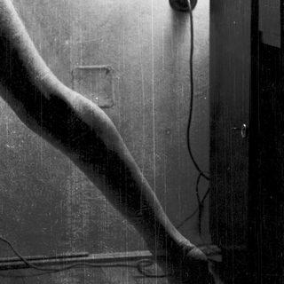 Vintage telephone cord and wall junction.