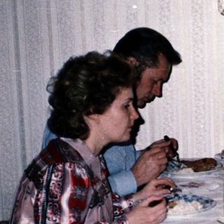 Family dining together indoors at a table.
