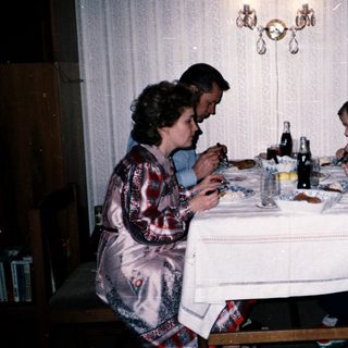 Family dining together indoors at a table.
