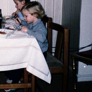 Family dining together indoors at a table.