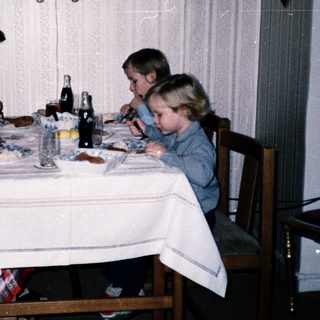 Family dining together indoors at a table.