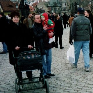 People walking on Prague's Charles Bridge.