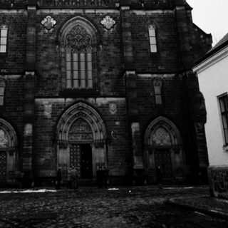 Gothic-style church with twin spires and intricate stonework.