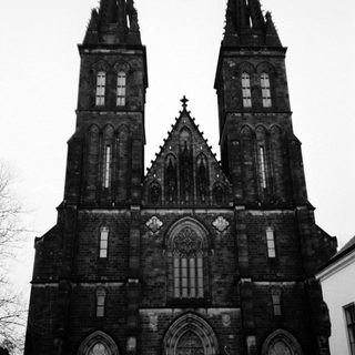 Gothic-style church with twin spires and intricate stonework.