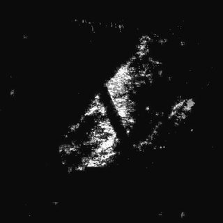 Lunar surface with prominent crater and ray system.
