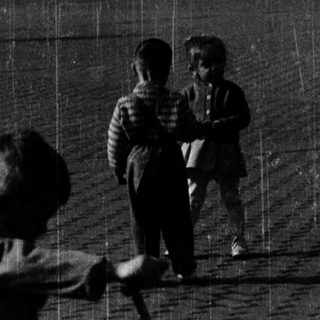Children playing with baseball bats in rain.