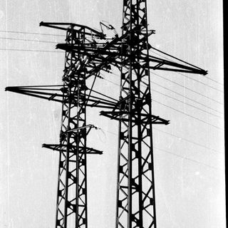 High-voltage transmission tower with power lines.