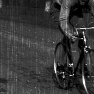 Cyclist riding in heavy rain.