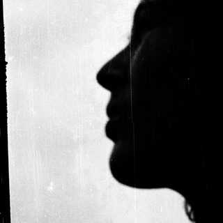 Silhouette of a person's profile in silhouette.