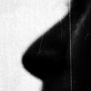 Silhouette of a person's profile in silhouette.