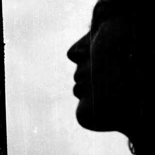 Silhouette of a person's profile in silhouette.