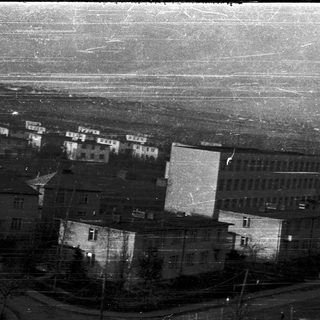 Aerial view of old, densely packed residential buildings.
