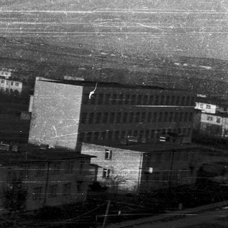 Aerial view of old, densely packed residential buildings.