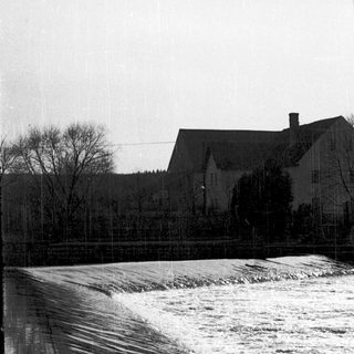 Water cascading over a spillway in rural area.