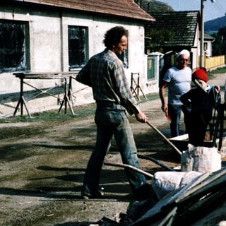 Group of men constructing a concrete foundation.