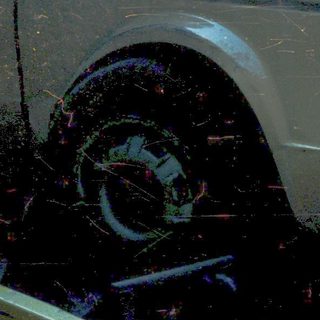 Severely damaged car on tow truck.