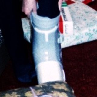 Family opening holiday gifts indoors.