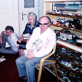 Group gathering in a toy-filled room.