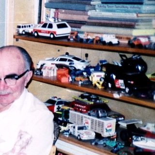 Group gathering in a toy-filled room.