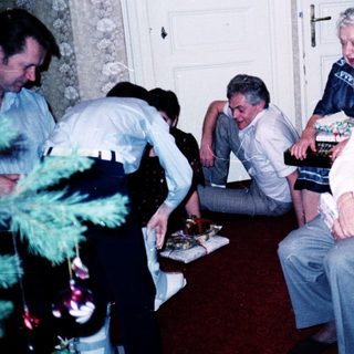 Group gathering in a toy-filled room.