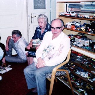 Group gathering in a toy-filled room.