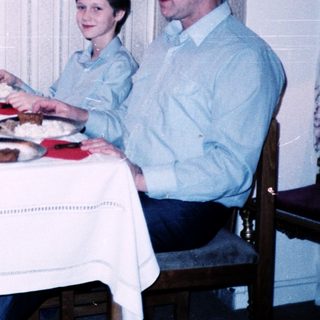 Family dining together indoors at a table.
